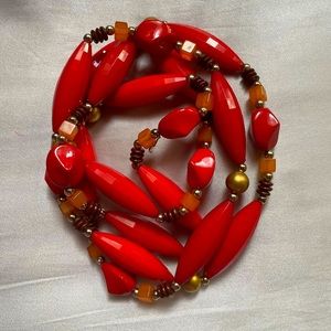 22” Necklace with shades of orange, gold tone burnt orange and brown.